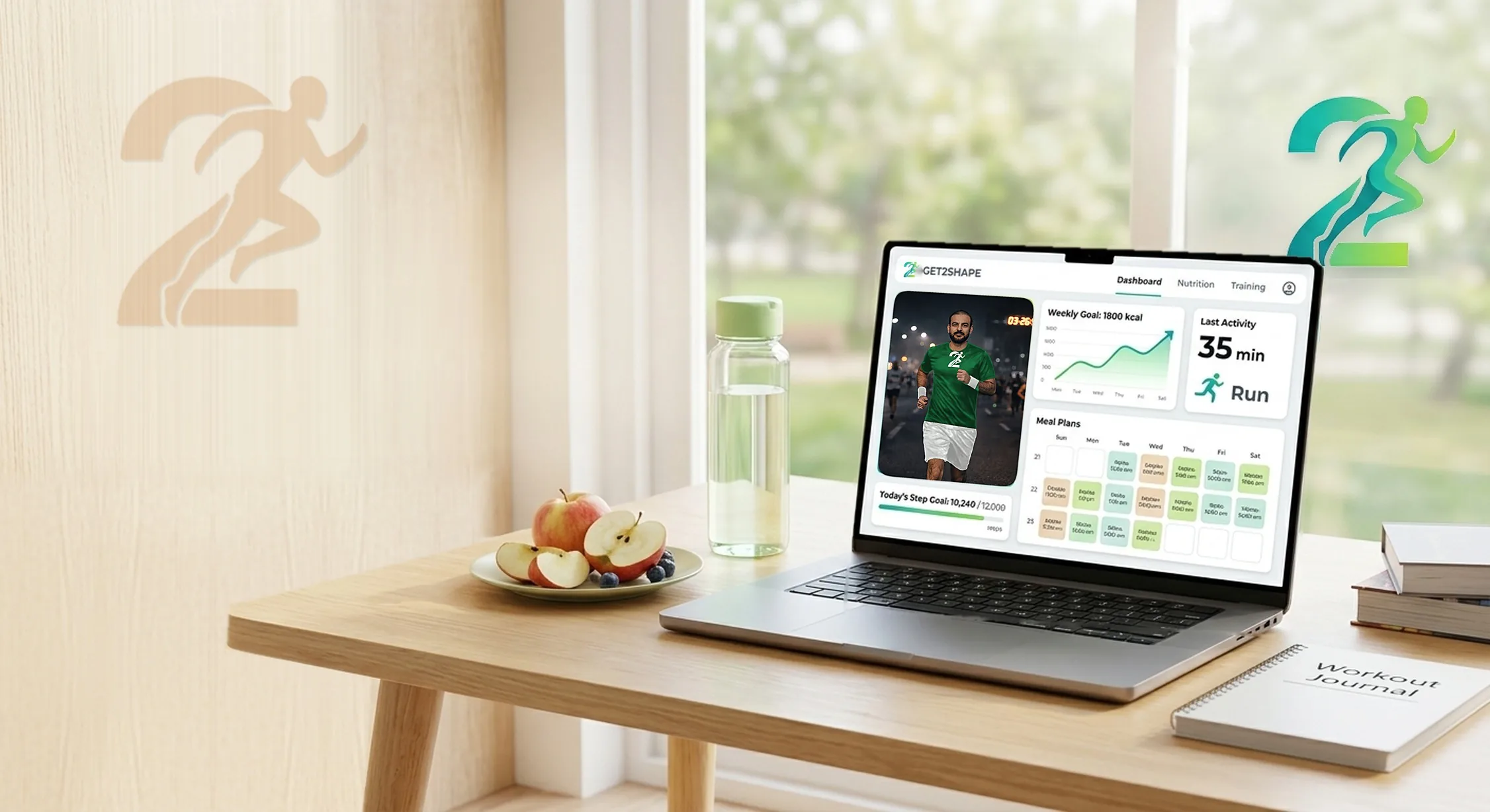 A laptop showing the Get2Shape dashboard on a sunny desk, with sliced apples, a water bottle and a workout journal